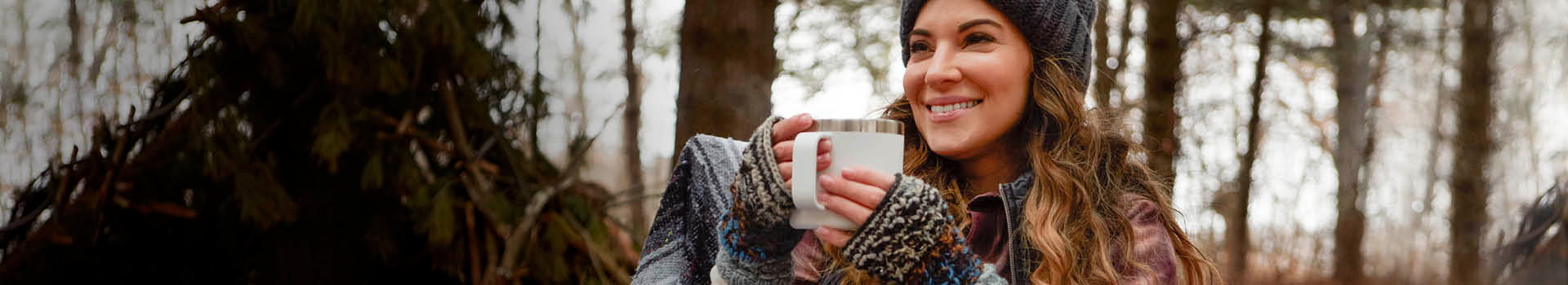 lady with cup winter woods
