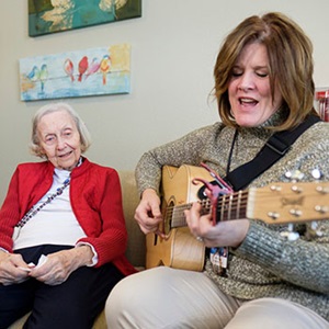 Angela Joan Adkins has unspecified dementia. Her music therapist, Roxie Raykovich, part of the Hospice team, took a unique approach to bring back special memories by playing a song written by Joan's son, Guy, who passed away after a battle with cancer.