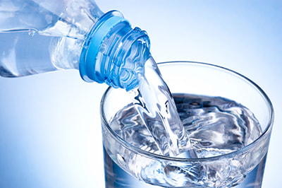 bottle-of-water-pouring-into-glass