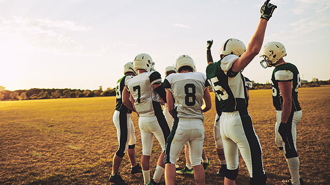 Football team huddle