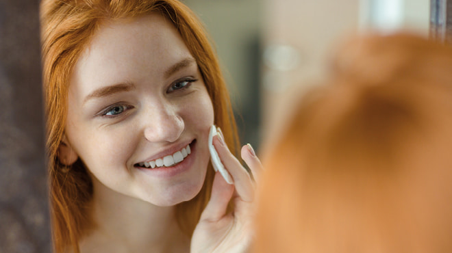 Teenage girl doing face care