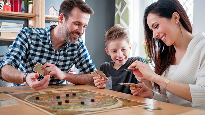 Family playing board game