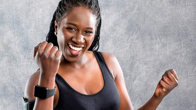 Pumped woman after working out, wearing an Apple watch.