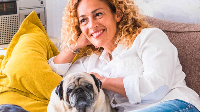 Dog and woman sitting together