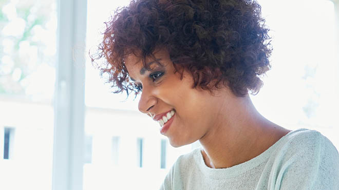 Smiling woman looking off to side