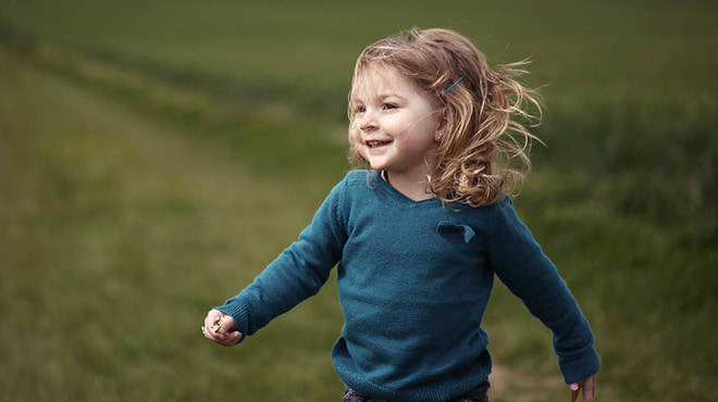 Toddler running, hair blowing