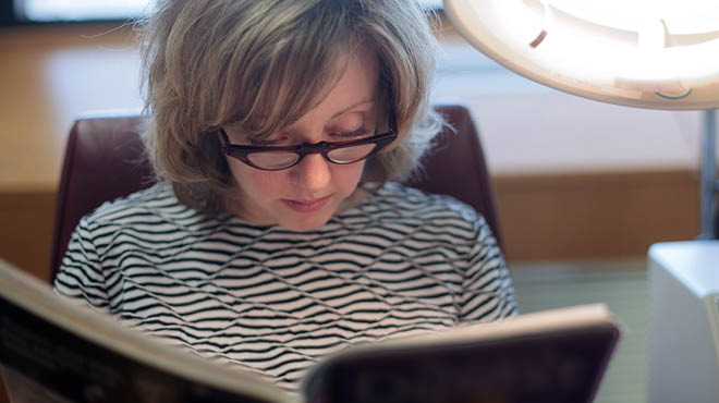 Reading with glasses and light