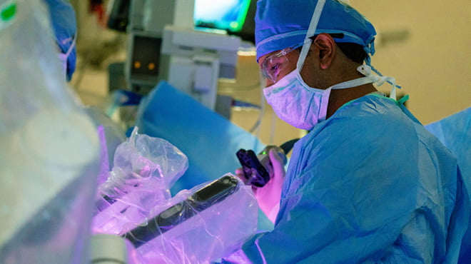 Surgeon performing robotic surgery