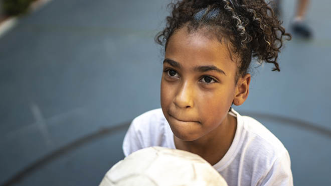 Child holding ball