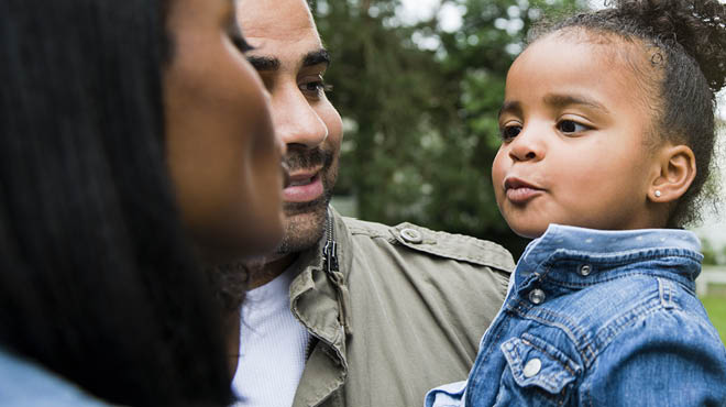 Parents holding toddler