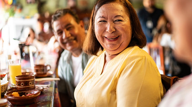 People smiling at mealtime