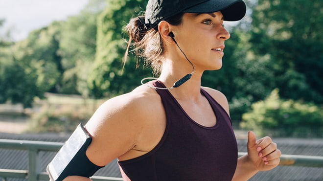 Runner wearing arm smartphone holder