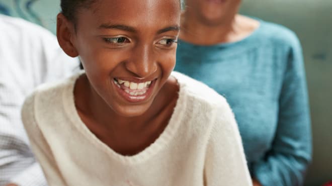 Smiling child in ivory sweater