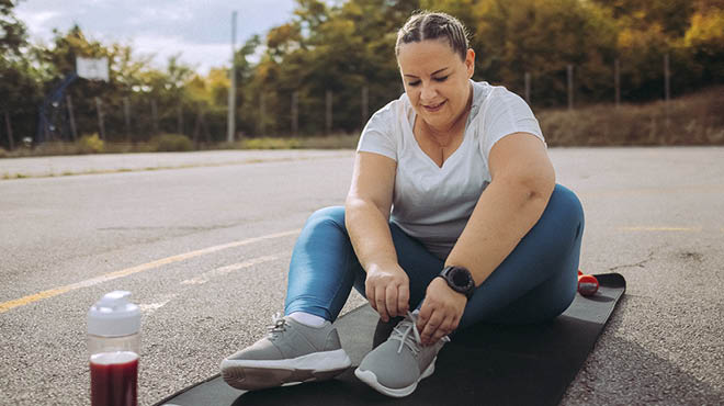 Tying shoes while sitting