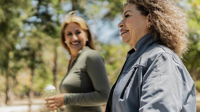 2 ladies walking outdoors