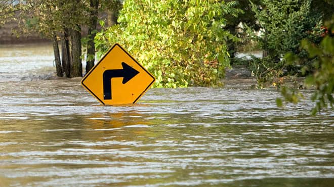 Flooded road and sign