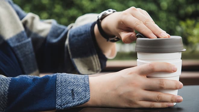 Opening lid on coffee cup