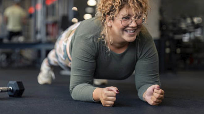 Person in gym in plank position