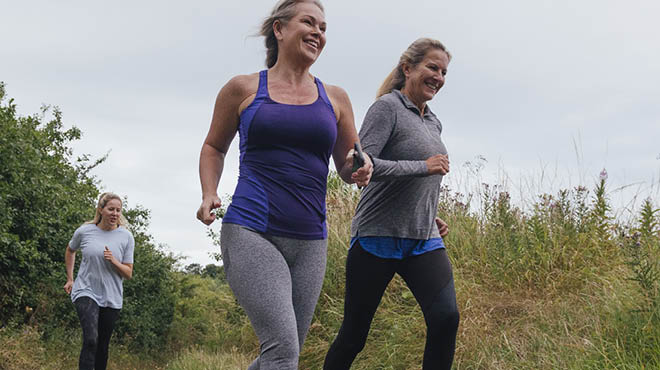 Three people running ourdoors